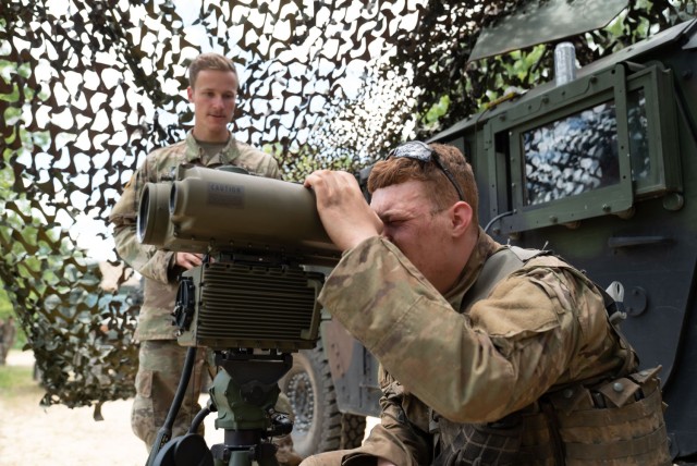 A Soldier in the Wisconsin Army National Guard’s 1st Squadron, 105th Cavalry is tested on his ability to set up and operate various optics that the cavalry may use in the field as part of a voluntary qualification course known as a Spur Ride....
