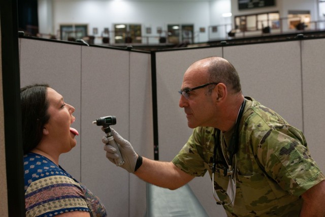 Lt. Col. Dan Tzizik, the medical officer in charge from the New Hampshire Army National Guard Medical Detachment, screens Tara Parker Dorler, a daycare provider, during the Cherokee Nation Innovative Readiness Exercise June 5, 2022. Parker Dorler...