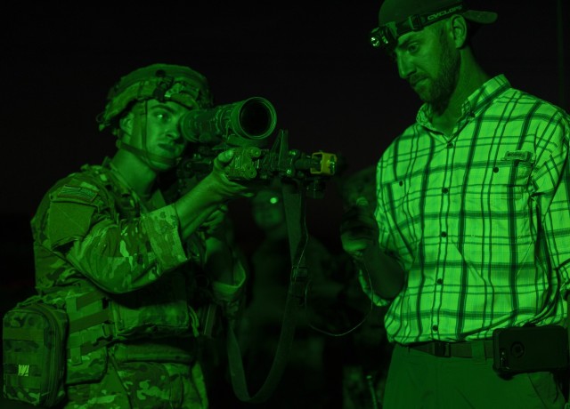 A Soldier tests out a Synthetic Training Environment Live Training System prototype at night.