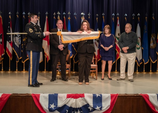 The Senior Executive Service flag is unfurled during a ceremony for Anne Marie Petrock, who was appointed as the U.S. Army’s Senior Research Scientist for Warheads Technology during a ceremony at Picatinny Arsenal on April 18. 