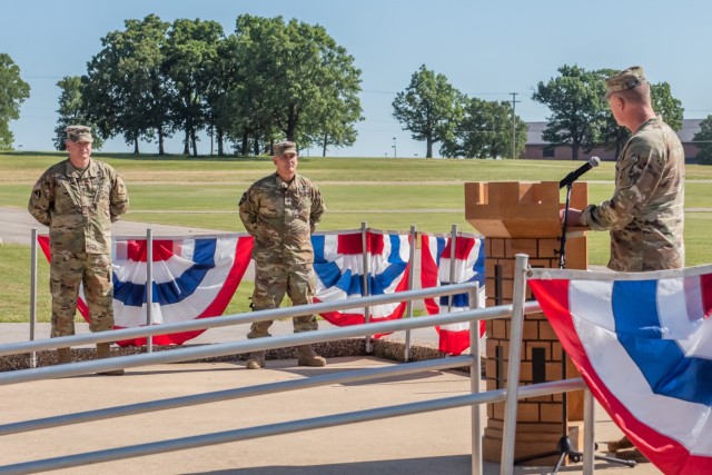 Col. Daniel Hibner, U.S. Army Engineer School commandant, speaks to Cols. Aaron Bohrer (left) and Gerald Law during the 1st Engineer Brigade change-of-command ceremony Wednesday on Gammon Field. During the ceremony – in which Hibner was the reviewing officer – Law relinquished command of the brigade to Bohrer. 