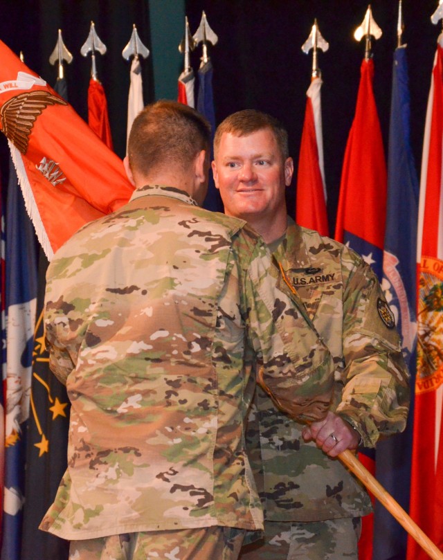 Lt. Col. Charles Walsh, incoming commander of the 60th Signal Battalion (Offensive Cyber Operations), receives the “Victory” battalion guidon from Col. John Popiak, Army Cyber Protection Brigade commander, during the battalion’s change of...