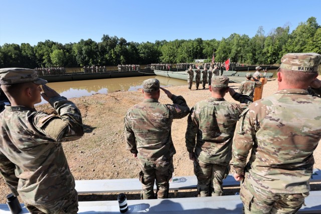 Members of 19th Engineer Battalion salute for the singing of the national anthem at their June 30, 2022 change of command ceremony at Tobacco Leaf Lake.