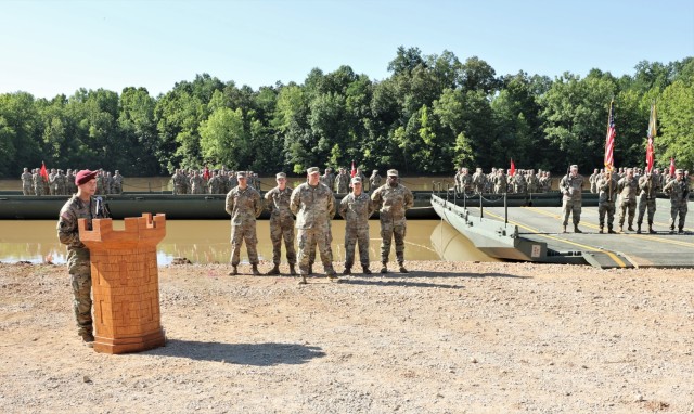 The ceremony host, 20th Engineer Brigade Commander Col. Daniel Herlihy, shares remarks about outgoing 19th Engineer Battalion Commander Lt. Col. Christopher Beal and incoming commander Lt. Col. Todd Bradford during the June 30, 2022 change of command at Tobacco Leaf Lake.
