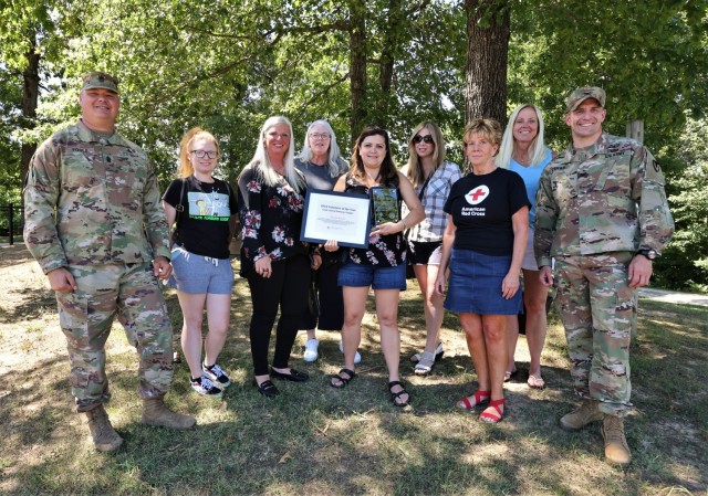 Fort Knox American Red Cross chapter 2022 Volunteer of the Year recipient Suzie Rendon is honored for her service to the community by fellow volunteers and Fort Knox Garrison Commander Col. Lance O’Bryan and Garrison Command Sgt. Maj. William Fogle June 29.