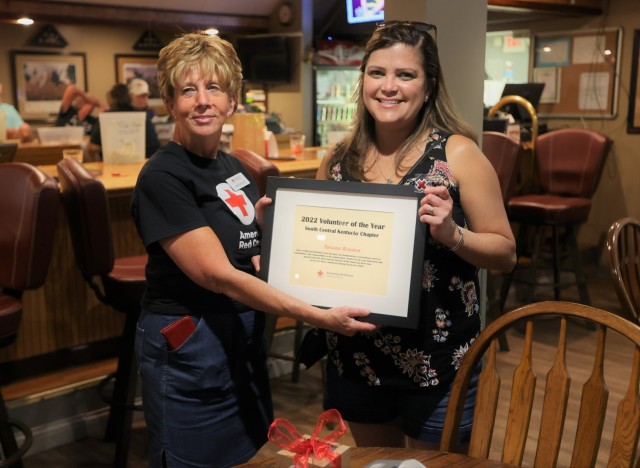 Fort Knox American Red Cross chapter 2022 Volunteer of the Year recipient Suzie Rendon (right) receives her award at a ceremony June 29.