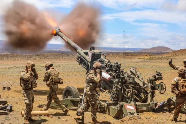 Soldiers fire a howitzer during training in Hawaii, June 23, 2022.
