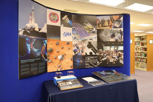 Replicas of asteroid samples from the Japanese-led space mission are on display in the Camp Zama library