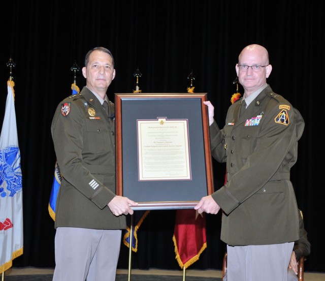 ASA(ALT) Principal Military Deputy Lt. Gen. Robert L. Marion presents the PEO Combat Support & Combat Service Support Charter to Peterson, the Army’s newest brigadier general and program executive officer.