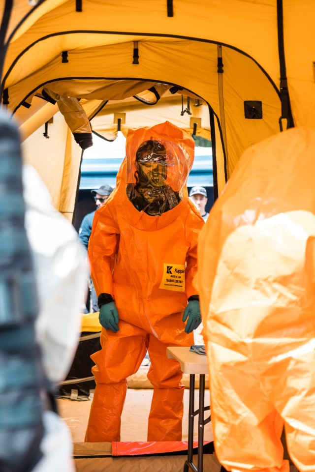 Staff Sgt. Jordan Cowart, 10th Civil Support Team, Washington National Guard, awaits decontamination following entry into a training lane in Bellevue, Wash., June 16, 2022. (U.S. National Guard photo by Peter Chang)