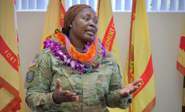 Master Sgt. Herinah Asaah speaks at an award ceremony and farewell event in her honor