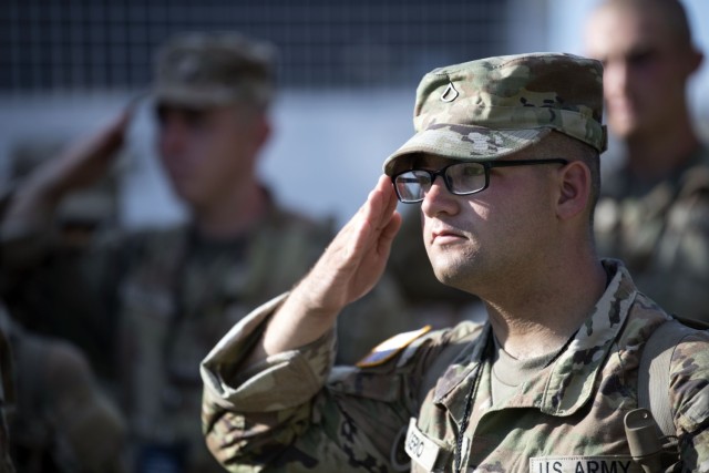 Pfc. Jacob Boerio, a trainee at Fort Jackson, S.C., salutes during the playing of the national anthem at the start of the installation's Independence Day celebration July 2. The event was the first time in five years Fort Jackson held fireworks for July 4th.