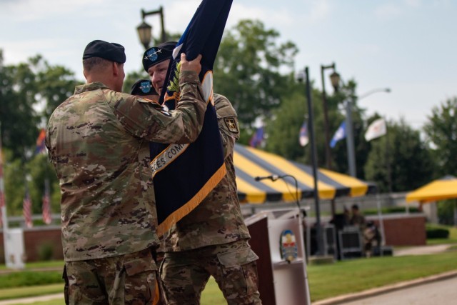 U.S. Army Chief of Staff, Gen. James C. McConville, passes the U.S. Army Forces Command colors to the incoming commander, Gen. Andrew P. Poppas, during the FORSCOM Change of Command Ceremony.