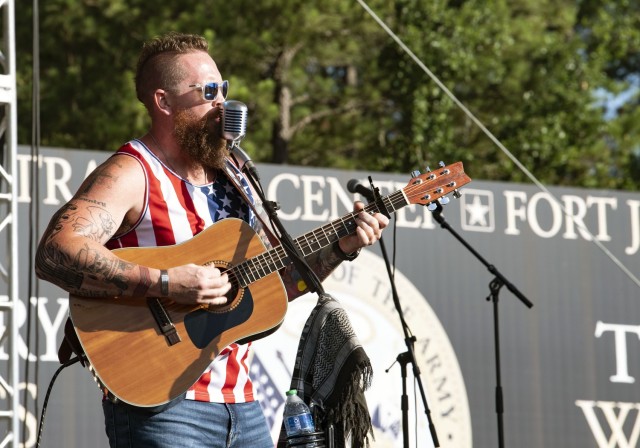 Musician and Navy veteran Brooks Herring sings a patriotic tune during the opening moments of Fort Jackson's Independence Day celebration July 2 at Hilton Field on post.