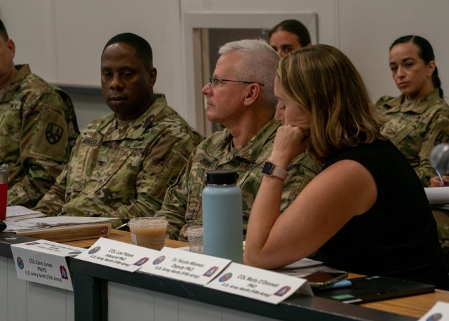 Dr. Nicole Wieman, the U.S. Army North public affairs deputy, presents to the group the public affairs plans during the presentation at the 2022 Hurricane Rehearsal of Concept drill, at Joint Base San Antonio-Fort Sam Houston, Texas, April 25, 2022. The primary purpose of the rehearsal was to prepare participants to support the Federal Emergency Management Agency, the lead federal agency for hurricane response, during the 2022 Atlantic Hurricane Season, which begins June 1. In addition to response and recovery-focused discussions participants also talked about national resiliency in support of the National Response Framework. (U.S. Army photo by Sgt. Ashlind House /U.S. Army North)