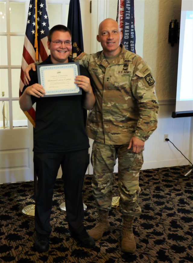 Commanding General of the U.S. Army Cadet Command and Fort Knox Maj. Gen. Johnny Davis presents each of the four student recipients with certificates representing scholarships from the Armed Forces Communications and Electronics Association at the...