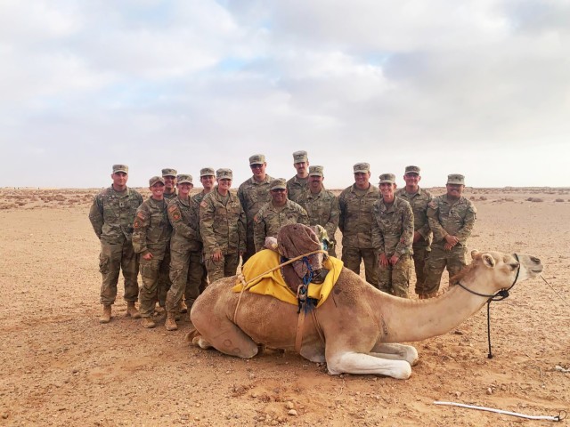 Members of the Wisconsin Army National Guard’s Battery A, 1st Battalion, 121st Field Artillery at Tan-Tan, Morocco, after a dinner hosted by the Moroccan field artillery regiment celebrating a simulated High Mobility Artillery Rocket System...