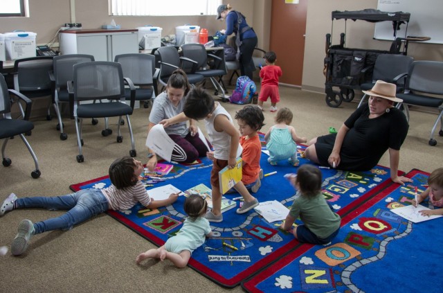 Garrison chaplain reads for FAP Budding Bookworms event