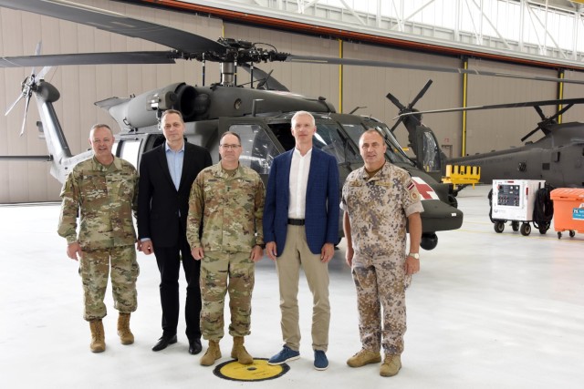 Left to right, U.S. Army Brig. Gen. Lawrence Schloegl, assistant adjutant general-Army, Latvian Ambassador Māris Selga, U.S. Army Maj. Gen. Paul Rogers, adjutant general and director, Michigan Department of Military and Veterans Affairs, Latvian Prime Minister Krišjānis Kariņš, and Defense Attaché Maj. Gen. Andis Dilāns tour the 3rd Battalion, 238th Aviation Regiment aircraft facility, Grand Ledge Armory, Michigan, July 1, 2022. For nearly 30 years, the Michigan National Guard and Latvia have partnered under the Department of Defense National Guard Bureau State Partnership Program. (U.S. Air National Guard photo by Master Sgt. David Eichaker)