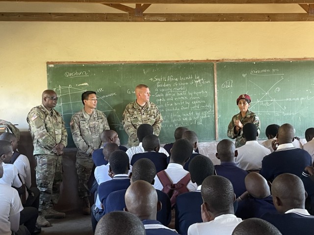 Soldiers from the New York Army National Guard, the U.S. Army Reserves and the South Africa National Defense Force speak with students at Khanyiselisizwe High School for Nelson Mandela International Day July 18, 2022. The U.S. Soldiers are in South Africa for Exercise Shared Accord, a biannual training event to enhance operational skills and its partnership with South Africa. 

