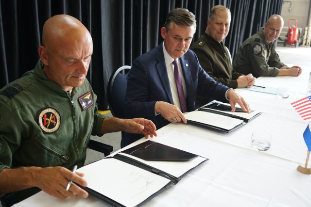 Dutch Ministry of Defence&#39;s Maj. Gen. Andre Steur, left, and Assistant Secretary of the Army for Acquisition, Logistics and Technology Douglas Bush, second from left, signed the Future Rotorcraft Concept Analysis project arrangement in a...