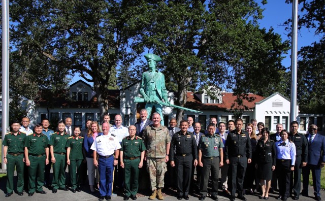 The Washington Air National Guard, Royal Thai Armed Forces, Indonesian National Armed Forces and the cyberspace operations professional from the Vietnamese military explored strengthening cybersecurity efforts during a conference at Camp Murray, Wash., July 11-15, 2022.  (U.S. National Guard photo by Joseph Siemandel)