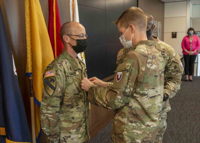 (From right) U.S. Army Security Assistance Command Commanding General Brig. Gen.  Brad Nicholson pins colonel rank on Chaplain Jonathan Fowler during a July 20, 2022 ceremony at the command&#39;s Redstone Arsenal headquarters in Huntsville, Alabama. Fowler joined USASAC as the command chaplain in June 2022.