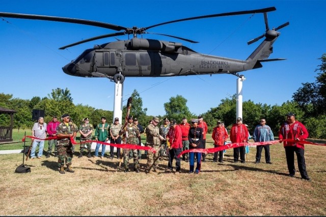 A ribbon cutting marks the dedication of a UH-60A Black Hawk helicopter at the Sac and Fox Nation Veterans Memorial in Stroud, Okla., July 9. 