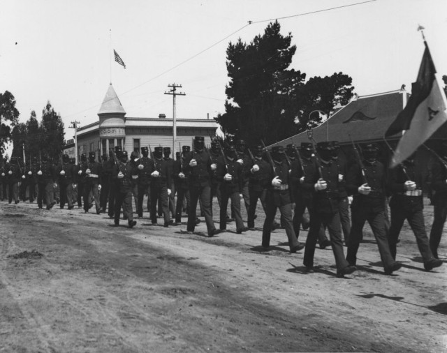 Buffalo Soldiers stationed at the Presidio of Monterey in the early 1900s march in a parade in Pacific Grove, Calif.