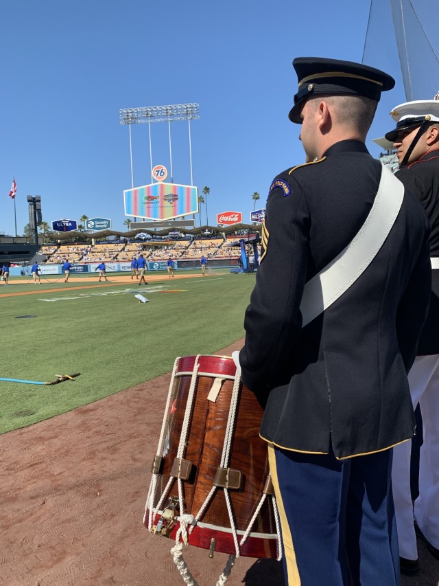 A drummer from The United States Army Field Band prepares to accompany a Joint Armed Forces Color Guard at the MLB All-Star Game in Los Angeles, July 19, 2022.