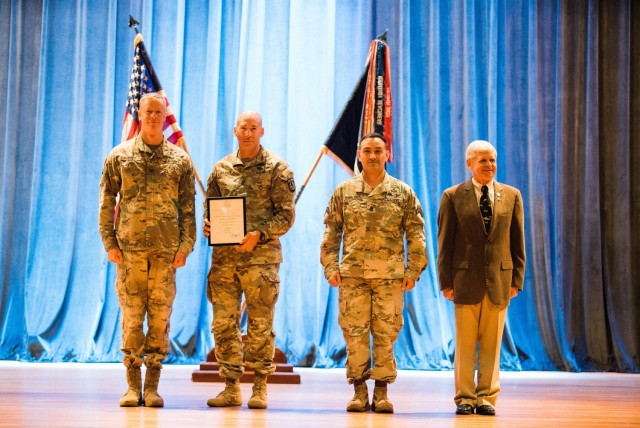 DEVCOM Command Sgt. Maj. Bryan D. Barker was inducted as a Distinguished Member of the 75th Ranger Regiment on July 19, 2022. (Left to right) Col. JD Keirsey, Commander 75th Ranger Regiment; Command Sgt. Barker; Command Sgt. Maj. Curt Donaldson, Regimental Command Sgt. Maj., 75th Ranger Regiment; and Command Sgt. Maj (Ret.) Michael Hall, Honorary Command Sgt. Major, 75th Ranger Regiment.