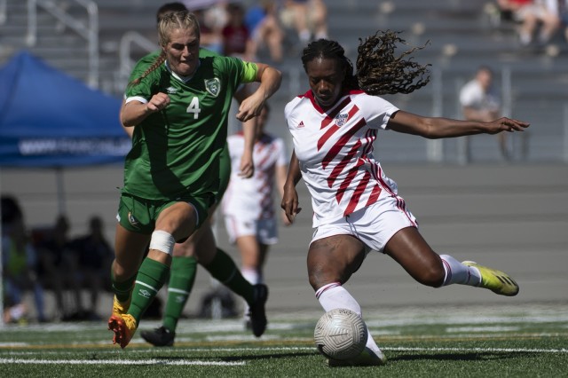 Army 1st Lt. Haley Roberson, right, kicks a ball during the Americans&#39; 5-0 win over Ireland on July 19, 2020. The United States finished fourth in the 2022 World Military Women&#39;s Football Championship in Spokane, Wash.