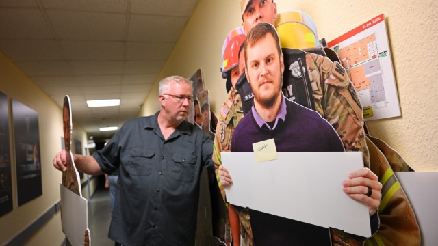 Garrison employee’s face with message innovation goes theater-wide