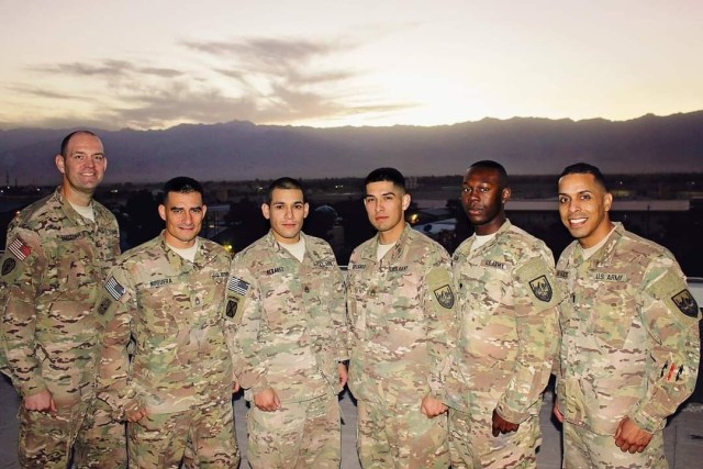 Chief Warrant Officer 5 Edwin De La Cruz Jr. pictured with fellow Soldiers in Afghanistan in 2015.