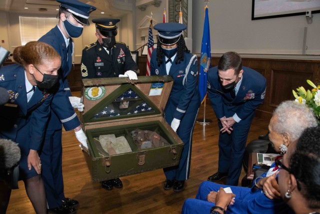 Col. Eries Mentzer, Commander, 42d Air Base Wing, Chief Master Sgt. Lee Hoover, Command Chief Master Sergeant, 42d ABW, and Air Force and Alabama National Guard Honor Guard representatives present a shadowbox to Congressional Gold Medal recipient Private Romay Catherine Johnson Davis at Montgomery City Hall, July 26, 2022.

Mrs. Davis’s shadowbox is housed in an authentic World War II trunk. This trunk holds a uniform pieced together by Americans across the country after hearing Mrs. Davis’s story. Complete with a replica of Mrs. Davis’s medals and an original World War II Women’s Army Corps Patch. The flags encased were flown at each base Mrs. Davis served, including Fort Oglethorp, Ga., Camp Breckinridge, Ky., and Fort Des Moines, Iowa.