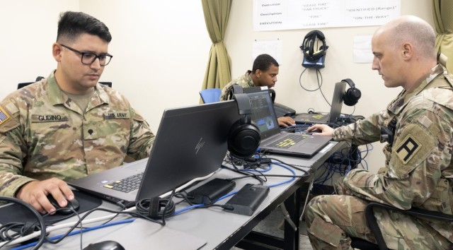 Staff Sgt. William Platten (right), an observer coach/trainer from First Army’s 177th Armored Brigade, conducts driver training with two members of the 810th Military Police Company, Spc. Hugo Gudino and Sgt. Alexander Harden, during Pershing Strike 22 at Camp Shelby, Miss.