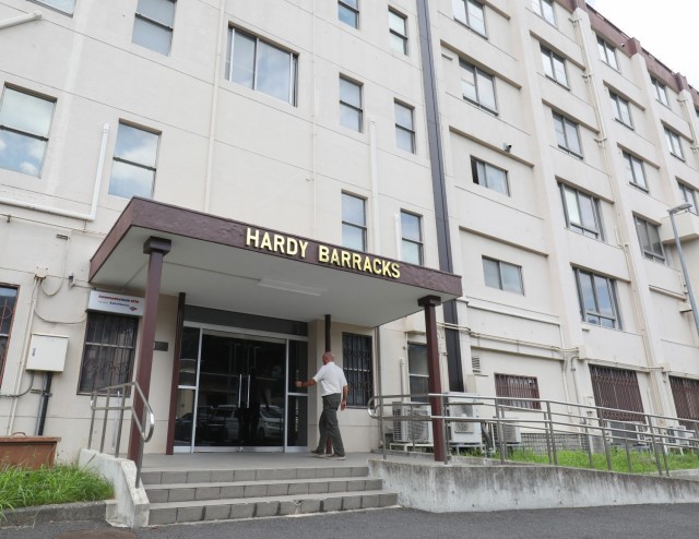 A person enters the front door of Hardy Barracks at Akasaka Press Center, Japan, July 28, 2022. The building was built in the 1960s and now serves as a recreational lodge, where military personnel and families can stay when exploring Tokyo.