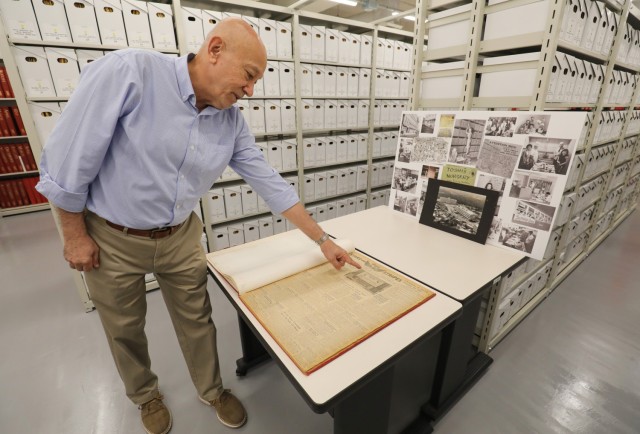 Michael Ryan, chief of staff for Stars and Stripes Pacific, shows the first copy of the newspaper that was printed in Japan in 1945 while inside an archive at Akasaka Press Center, Japan, July 28, 2022. The installation, which is managed by U.S. Army Garrison Japan, also has a recreational lodge called Hardy Barracks, where military personnel and families can stay when exploring Tokyo. 
