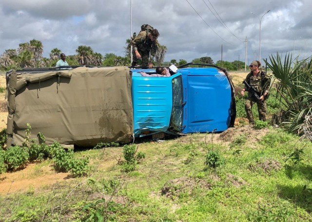 Virginia National Guard Soldiers assigned to 1st Squad, 1st Platoon, B Company, 1-116th Infantry Regiment, Task Force Red Dragon, Combined Joint Task Force - Horn of Africa, respond to a vehicle accident during an area security patrol May 25, 2022, Manda Bay, Kenya. (Courtesy photo)