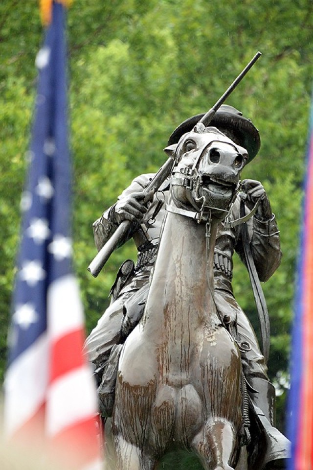 Rain streaks down the Buffalo Soldier Monument during a ceremony marking the statue’s 30th anniversary July 28 at Fort Leavenworth, Kan.