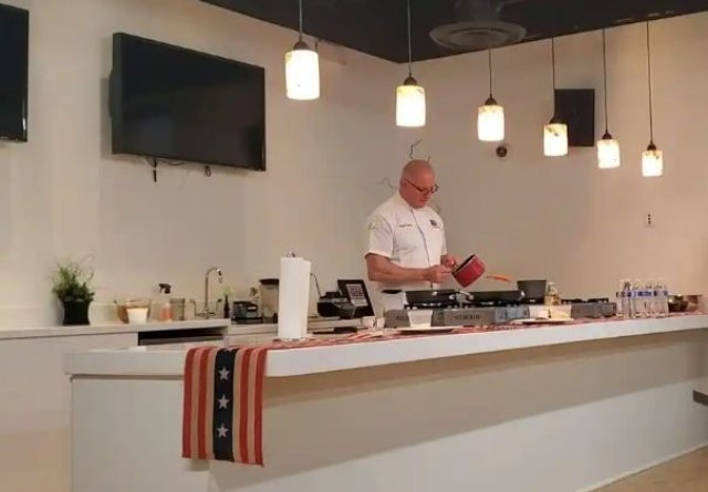 Chef Irvine cooks a healthy lunch for service members at the Fort Belvoir USO. 