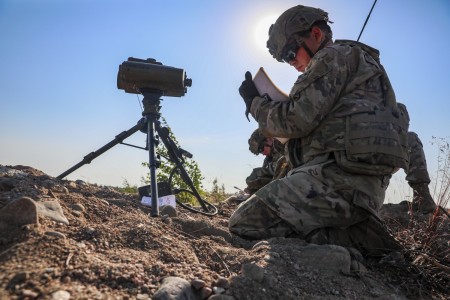 U.S. Army Spc. Joel Shawgo, an indirect fire infantryman assigned to the 4th Squadron, 10th Cavalry Regiment, 3rd Armored Brigade Combat Team, 4th Infantry Division, writes down coordinates after using a target locator module at Niinisalo, Finland, July 21, 2022.