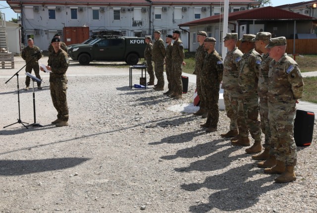 Soldiers from the Latvian National Contingent performed a transfer of authority ceremony at Camp Novo Selo Aug 02, 2022. The ceremony was attended by U.S. Army Regional Command East (RC-E) staff as well as command staff from the RC-E Maneuver Battalion.                (U.S. Army National Guard photo by Sgt. Alexander Hellmann)