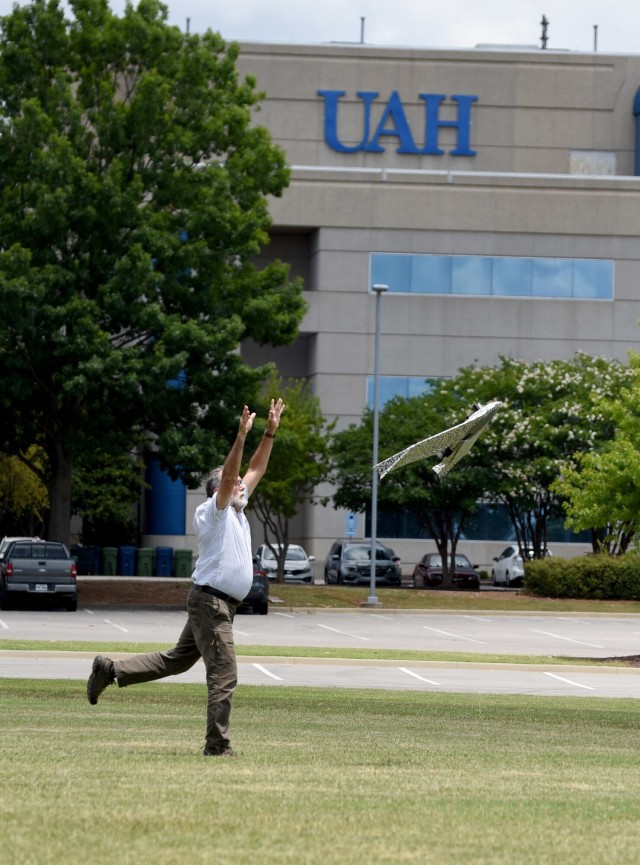 Huntsville Center&#39;s George Wade releases a drone for a flight over the UAH campus.