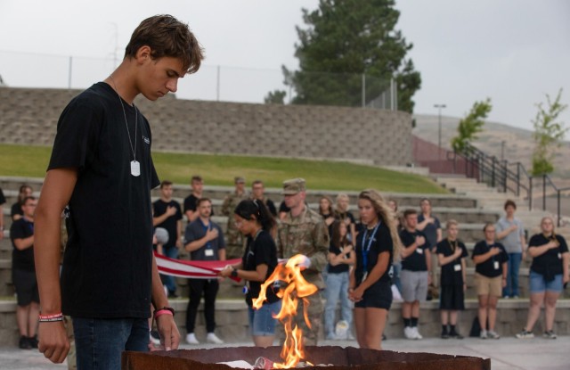 Freedom Academy delegates perform a flag retirement ceremony