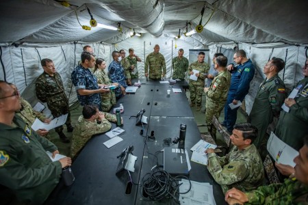 Military members from the U.S. and partner nation militaries conduct a briefing during PANAMAX 2022 on Joint Base San Antonio-Fort Sam Houston, August 4, 2022. PANAMAX 2022, a U.S. Southern Command-sponsored multinational command post exercise aimed at reinforcing and enhancing the long-term security of the Panama Canal and the Western Hemisphere, took place August 1-12, at bases in Texas, Florida, Virginia and Arizona. (U.S. Army photo by Spc. Joshua Taeckens)