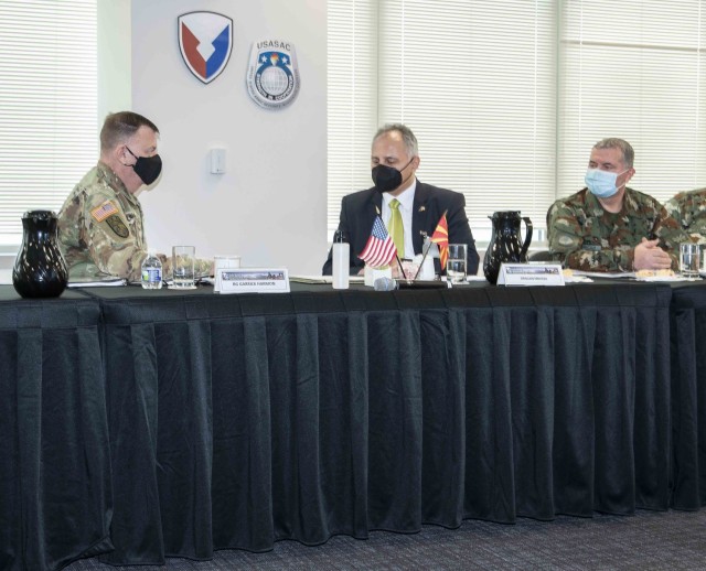 (From left) Former USASAC Commander Brig. Gen. Garrick Harmon discusses the foreign military sale of Stryker vehicles and other security assistance plans with Dragan Nikolic, North Macedonia&#39;s State Secretary in the Ministry of Defence, during a March 9, 2022 meeting at Redstone Arsenal in Huntsville, Alabama. 