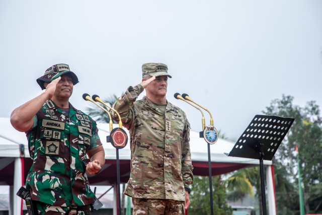 Gen. Charles Flynn, Commanding General of the U.S. Army Pacific and Gen. Andika Perkasa, Commander in Chief Indonesia National Defense Forces salutes the formation of troops during the opening ceremony of Super Garuda Shield 22, Baturaja, Indonesia, Aug. 3, 2022. Super Garuda Shield, a part of Operation Pathways and a longstanding annual, bilateral military exercise conducted between the U.S. military and Indonesia National Armed Forces, which has grown to 14 participating nations, reinforces the U.S. commitments to our allies, and regional partners, joint readiness, and the interoperability to fight and win together. (U.S. Army Reserve photo by Staff Sgt. Stephanie A. Hargett)