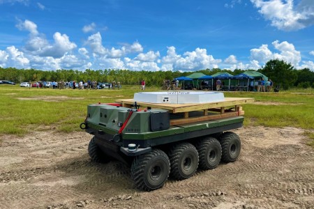 Autonomous Small Multipurpose Equipment Transport (S-MET) with small, unmanned aircraft system landing pad. 