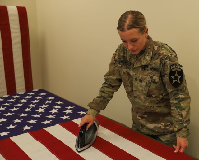 Mortuary Affairs Soldier gets ready to display flag